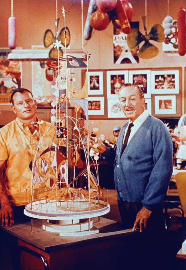 Walt Disney (Right) stands with project designer Rolly Crump next to a model of the "Tower of the Four Winds" that was later part of an attraction entrance at the World's Fair in New York. (Disney)
