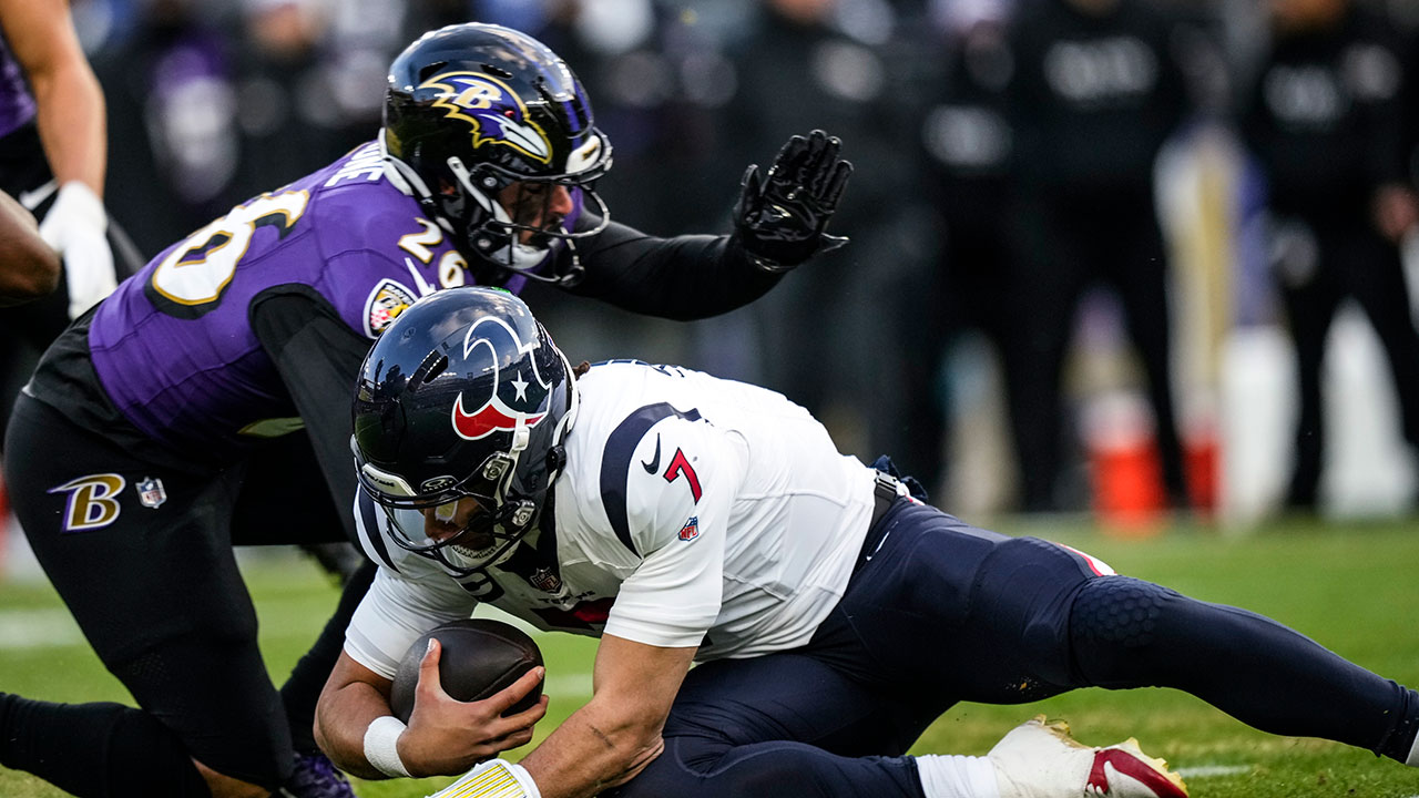 Baltimore Ravens safety Geno Stone (26) hits Houston Texans quarterback C.J. Stroud (7) during an NFL football AFC divisional playoff game on Saturday, Jan. 20, 2024.