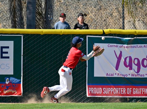 Los Alamitos’ Devin Porch (2) catches a fly ball in...