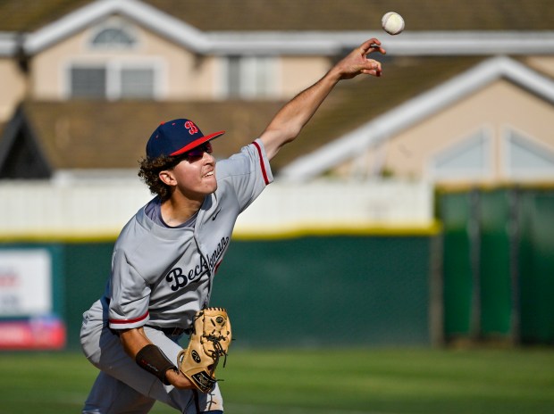 Beckman’s Rex Jarcy (34) delivers a pitch against Los Alamitos...