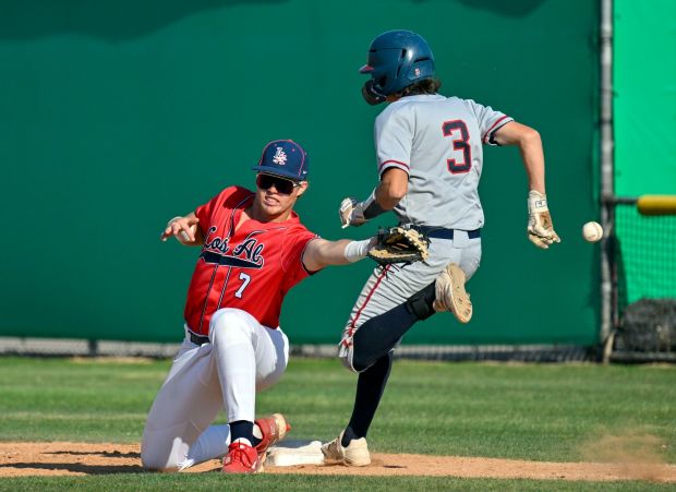 Los Alamitos' CJ Berthon (7) can't reach the throw to first base as Beclkman's Jagger Snitko (3) is safe during their CIF-SS Division 3 playoff game in Los Alamitos, CA, on Tuesday, May 14, 2024. Beckman defeated Los Alamitos, 3 to 0. (Photo by Jeff Gritchen, Orange County Register/SCNG)