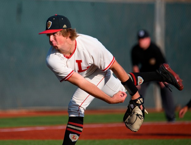 Orange Lutheran starting pitcher Colt Peterson delivers a pitch in...