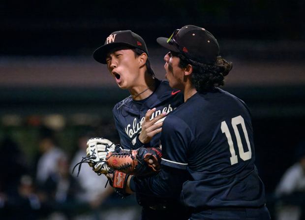 HarvardWestlake relief pitcher Jake Chung celebrates after striking out an...