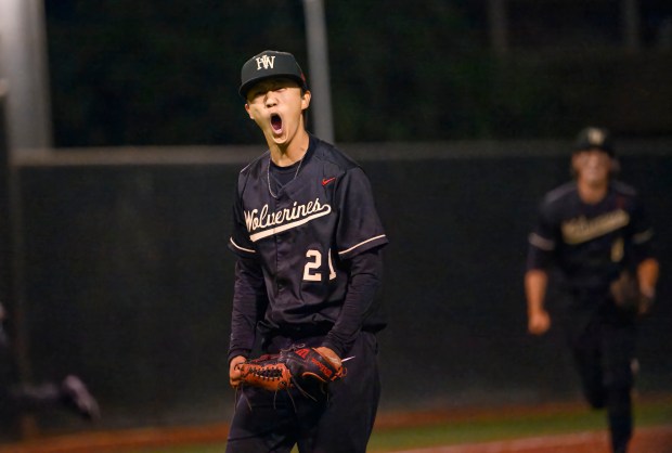 Harvard-Westlake relief pitcher Nate Blum lets out a yell to...