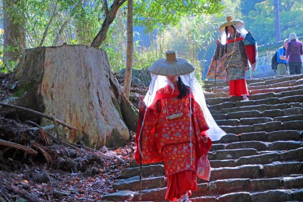 Women wearing Heian era costumes the attire of early pilgrims descend the Kumano's Daimon-zaka staircase near the Nachi Taisha shrine. (Photo by Norma Meyer)