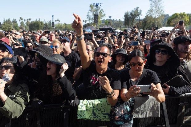 Fans of the band Ministry cheer during their performance on...