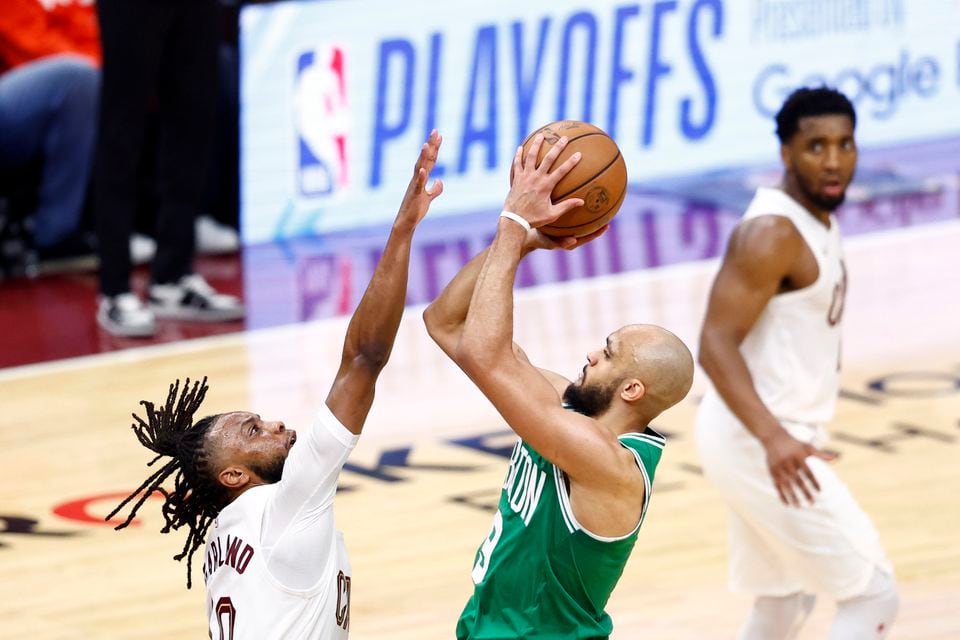 Derrick White (above) and Jrue Holiday are savvy guards who have established chemistry in their first season together with the Celtics.