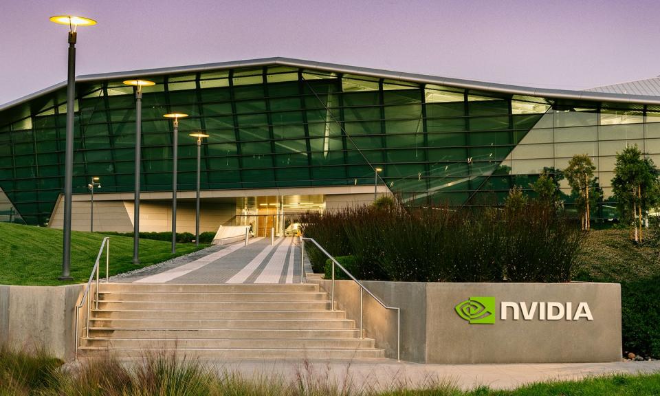 Nvidia headquarters with a grey sign with Nvidia's logo on it in front.