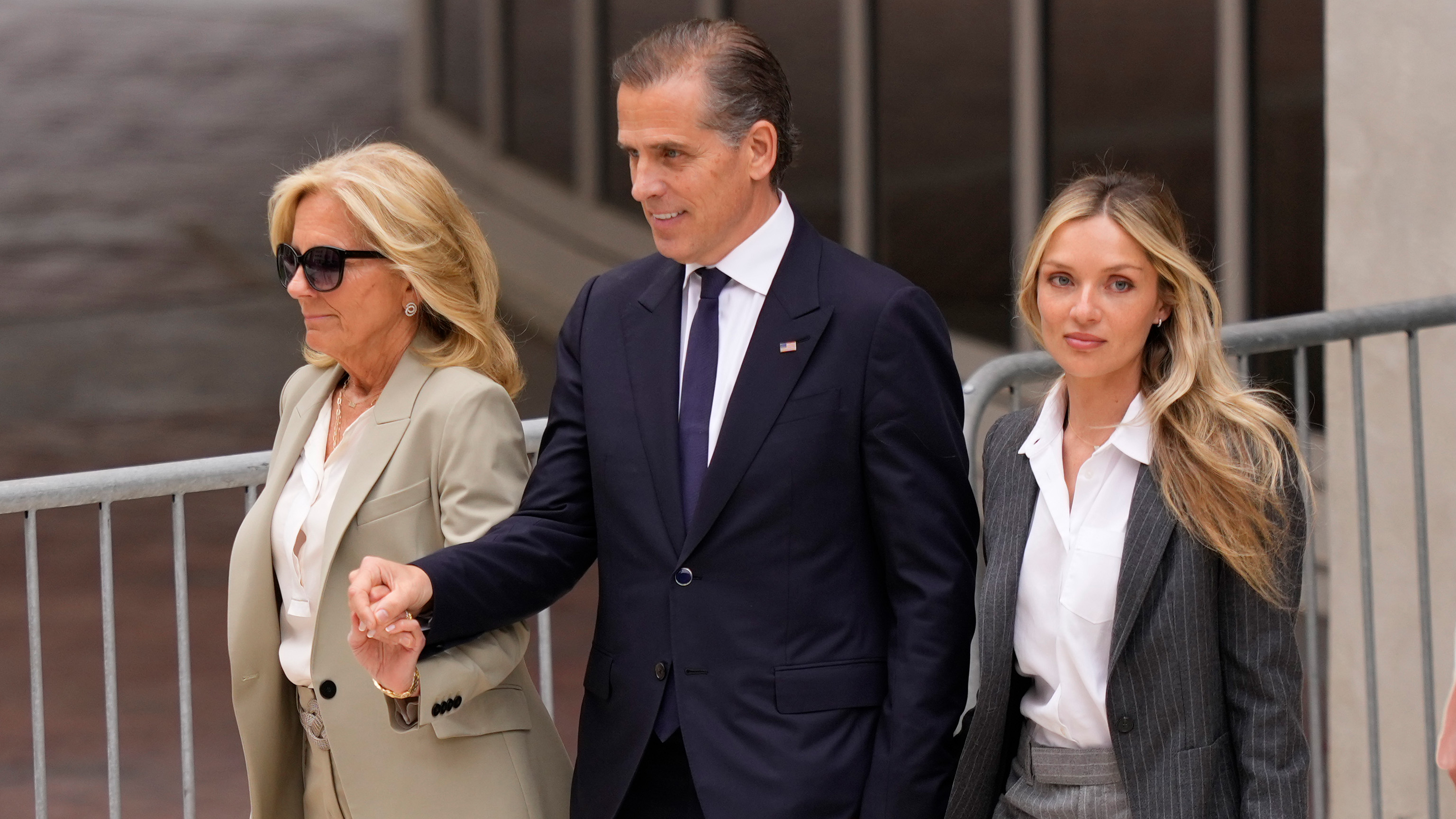 Hunter Biden, President Joe Biden's son, accompanied by his mother, first lady Jill Biden and his wife, Melissa Cohen Biden, walks out of federal court after hearing the verdict, Tuesday, June 11, 2024, in Wilmington, Del.