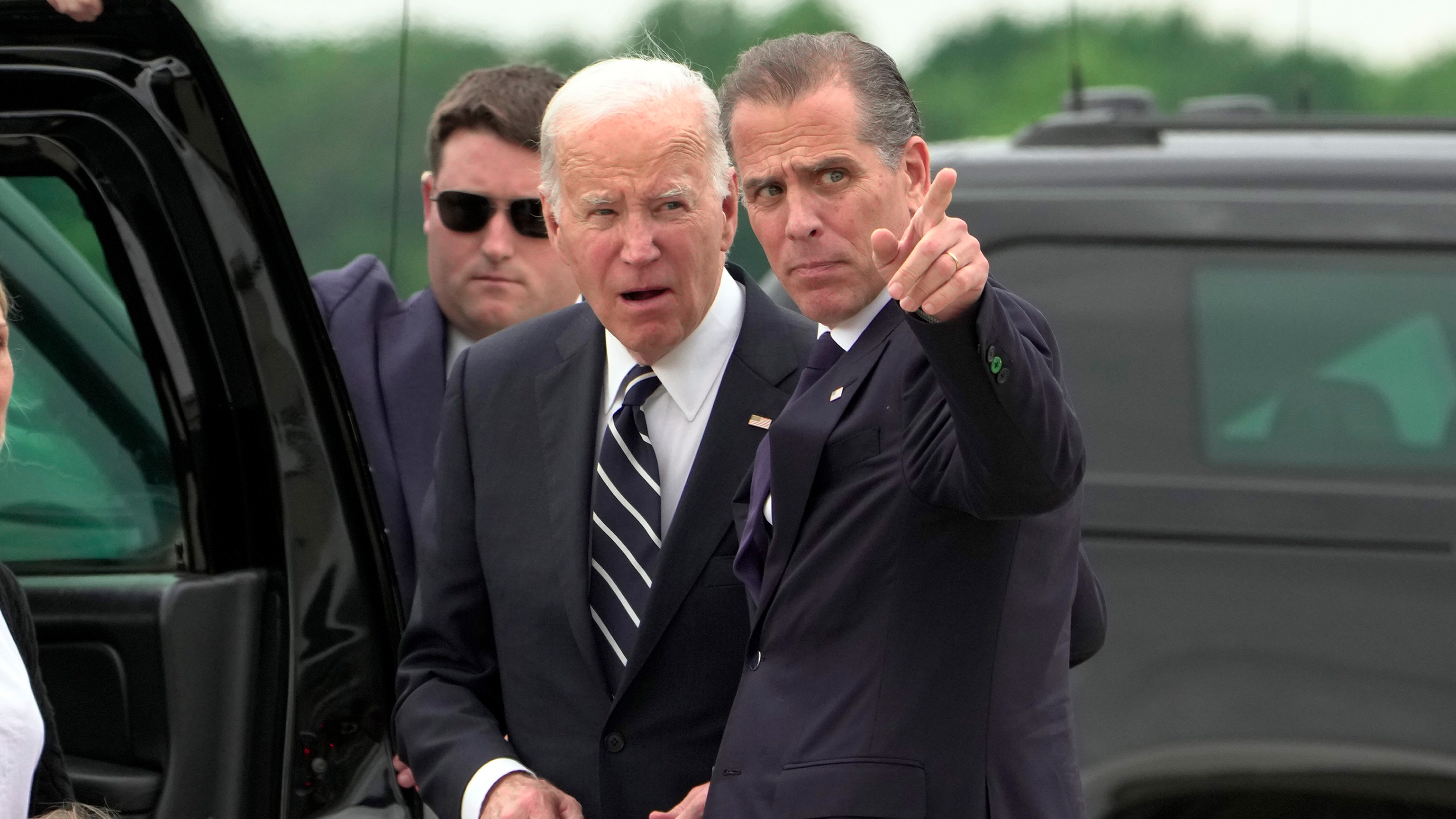 President Joe Biden talks with his son Hunter Biden as he arrives Delaware Air National Guard Base in New Castle, Del., Tuesday, June 11, 2024.